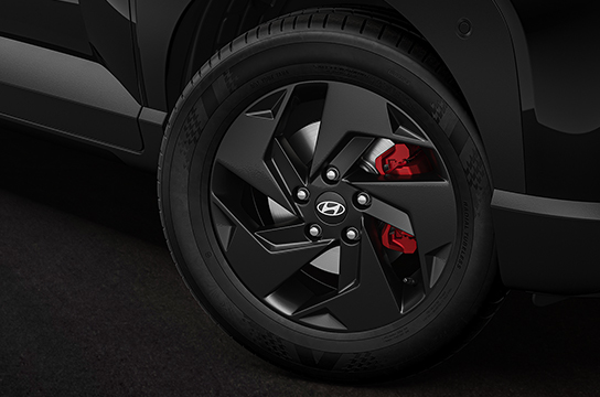 black painted alloys with red brake calipers