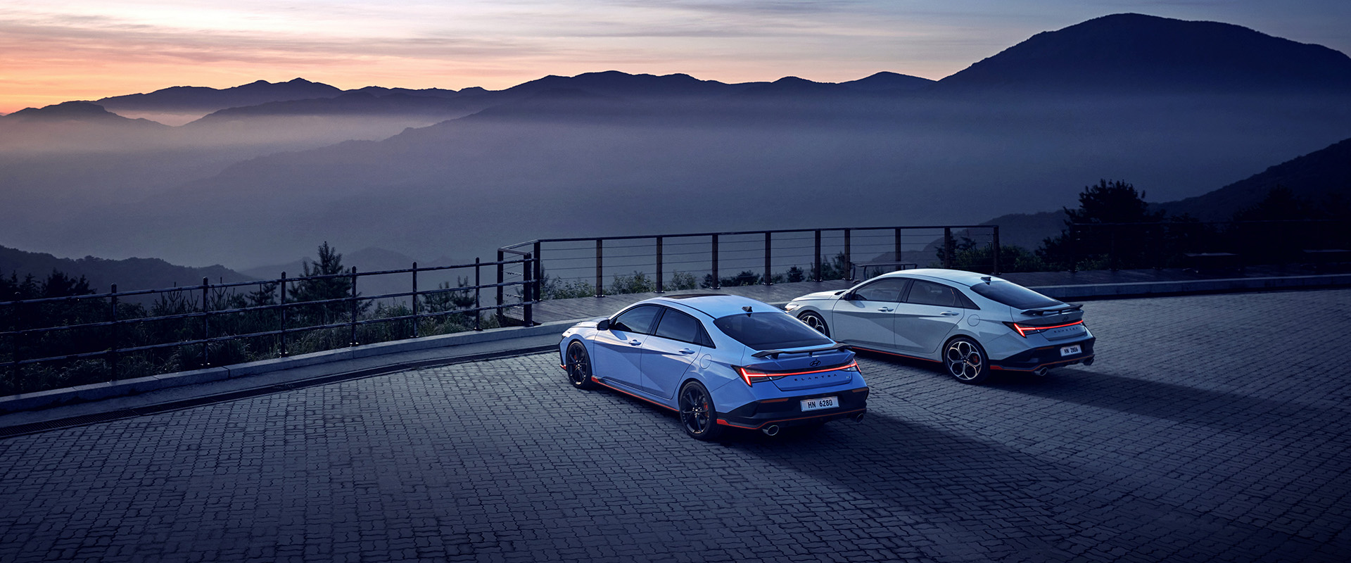 Two of New ELANTRA N, standing still, three-quarter rear view