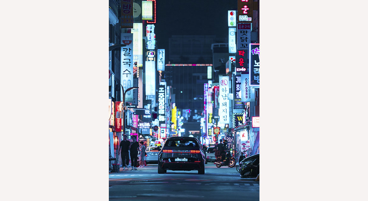 Sunkissed skies fade to dusky pink scenes before the neon glow of the night takes over Seoul's city streets