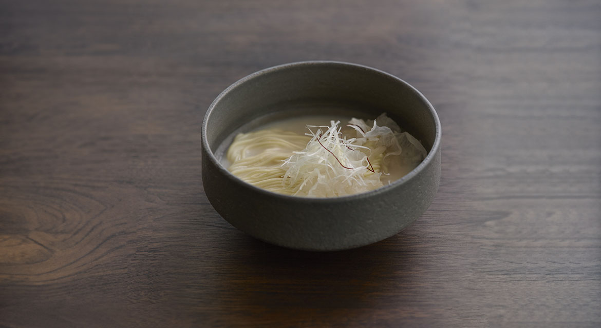 Seolloengtang features long-simmered beef, white cloud mushrooms, and house-made noodles, exemplifying the art of slow cooking. 