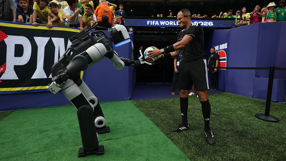 Atlas® delivers the ceremonial match ball to the referee during halftime of a Round of 16 match at New York/New Jersey Stadium at the FIFA World Cup 2026™.