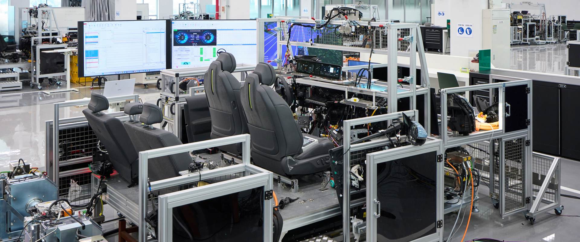 Engineer validates vehicle functions and electronic control systems using a full-scale wire-car test bench at NOVA Lab.