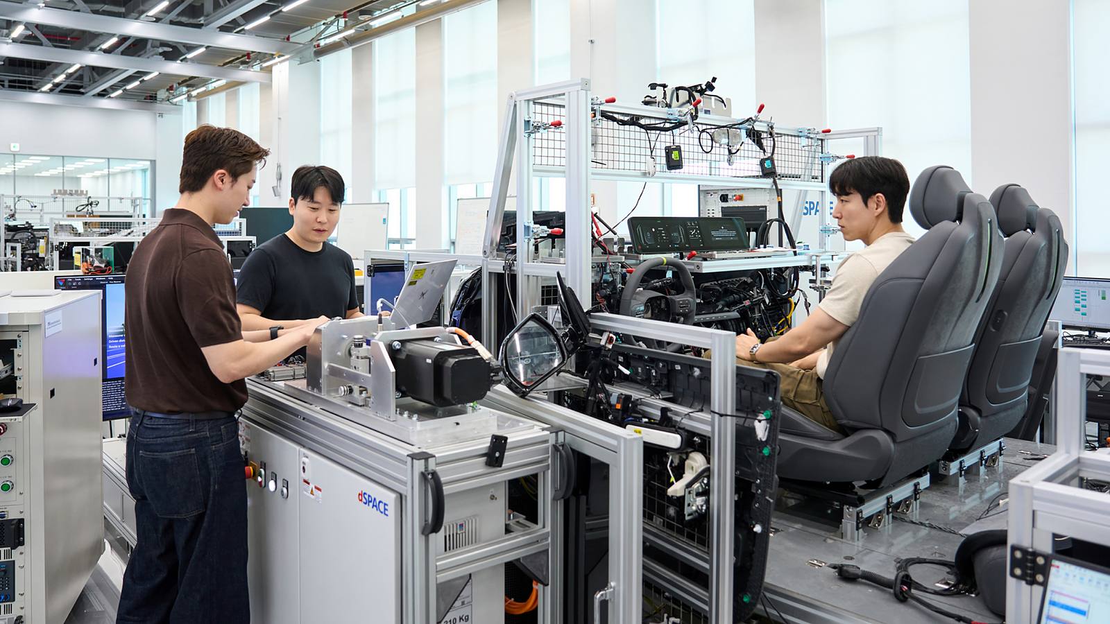 Engineer validates vehicle functions and electronic control systems using a full-scale wire-car test bench at NOVA Lab.