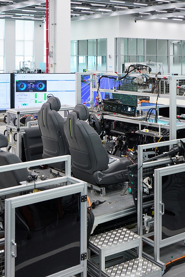 Engineer validates vehicle functions and electronic control systems using a full-scale wire-car test bench at NOVA Lab.